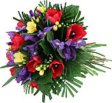 Awake! is a lively hand tied floral bouquet of red tulips, yellow freesia and purple iris.