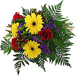 Brilliant birthday bouquet of yellow gerbera daisies, red roses and blue statice with hypericum berries and fern. This wrapped bouquet will tantalize and delight the recipient with it's bold colours and fresh, lively vibe.
