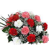 Pretty bouquet of one dozen pink, red and white carnations with baby's breath, greenery and red organza bow.