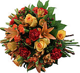 Gorgeous hand tied bouquet of yellow roses, orange spray roses, orange lilies and alstroemeria, with red carnations and red hypdericum berries.