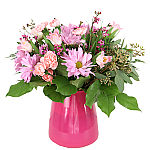 Pretty glass vase arrangement of pink miniature carnations, mauve daisies and pink waxflower. Suitable for any occasion or just because. Canada delivery.