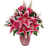Celebrate your anniversary by sending this awesome arrangement of pink roses and stargazer lilies. Show her how very special she is.