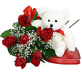Send her a Fairy Tale including all her romantic favourites · roses, chocolates and plush teddy bear.