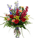 Happy anniversary flower arrangement by Canada Flowers. A beautiful free flowing vase of fresh flowers. An original design for discriminating tastes.