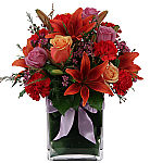 Say Happy Anniversary in a meaningful way with Horizon, a beautiful vase arrangement of orange and lavender roses, red lilies and carnations and pink waxflower.