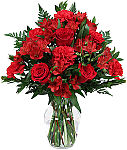 Celebrate your anniversary with a beautiful, passionate bouquet of all red flowers arranged in a red vase. Same day flower delivery across Canada.