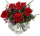 Contemporary vase arrangement of red roses. She will truly love them, and you. Same day delivery in Canada.