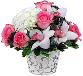 Our True Love flower arrangement is a beautiful design of cymbidium orchids, pink roses and hydrangea arranged with greens and special florist touches.