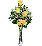 An elegant glass bud vase is arranged with three lush long stemmed yellow roses, ample baby's breath, greens and matching yellow ribbon.