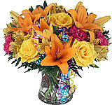 A festive vase of lilies, roses, and more to celebrate their Birthday!