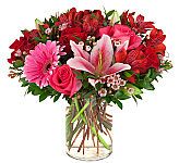 Loving You is a pretty pink and red flower arrangement in a glass vase for birthday gift giving across Canada.