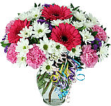 Pretty floral arrangement in a vase featuring stargazer lilies, yellow Gerbera daisies and much more for Birthday.