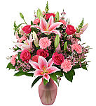 Canada Flowers Original design of premium pink flowers in a pink tinted vase, suitable for birthdays or any occasion. Same day flower delivery across Canada.