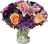 Gorgeous vase arrangement purple, pink, fuschia and peach coloured blooms for a wonderful birthday celebration.