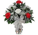 Colourful and affordable floral arrangement of three red and three yellow carnations with added baby's breath, greens and ribbon. Perfect for any occasion.