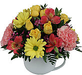 A delightful arrangement in a coffee mug that is sure to bring a smile to their face. Available for same day delivery across Canada.