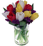 One dozen assorted colour tulips arranged in a clear glass cylinder vase. Same day flower delivery across Canada.