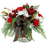 Affordable and pretty red and white flower arrangement in a glass vase for Christmas and holiday giving.
