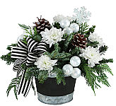 Make their dream of a white Christmas come true with this beautiful piece! White mums, ornaments, frosted pinecones and a black and white bow make this arrangement perfect for any holiday decor!