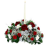 Send along A Merry Christmas floral centerpiece as an inviting addition to any home or holiday celebration.