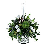This frosty bouquet is displayed in a stunning silver vase with white ornament balls, frosted pinecones, star of Bethlehem, blue thistle and a single silver candle! 