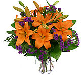 Bold, colourful orange lilies with purple statice arranged in a glass vase for Father's Day. Delivery across Canada. A Canada Flowers original floral gift.