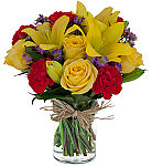 A cylinder vase arranged with yellow roses, yellow lilies, red carnations and purple asters for Father's Day.
