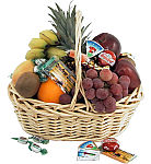 Fresh fruit in a basket with added cheeses and candies. A perfect gift for Father's Day from Canada Flowers. Delivery across Canada.