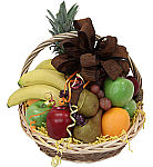 A handled wicker basket is filled with assorted fresh and healthy fruit selections including a pineapple. Next day delivery across Canada.