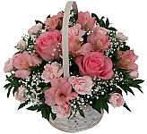 Pink flowers in a basket for friendship gift giving. Same day flower delivery across Canada.