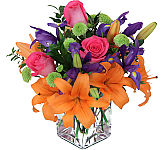 Sensation is a Canada Flowers Original gift of orange lilies, pink roses, purple iris and green button mums. Dazzling!