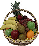 A handled wicker basket is filled with popular, fresh assorted fruit. Available across Canada.