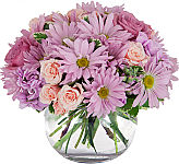 Send your best wishes for wellness with this lovely vased floral arrangement of soft pink and lavender flowers.