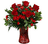 Express your affection and lasting love with this romantic flower arrangement of roses and miniature carnations in a red vase.