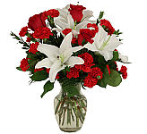 My One and Only is a superb romantic arrangement of red roses, red carnations and miniature carnations, with lush white lilies.