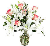 Gorgeous vase arrangement of white lilies and pink roses show her how much she is truly loved. Same day flower delivery across Canada with Canada's National Florist.