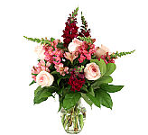 A lovely, romatic vase floral arrangement of pink roses, pink peruvian lilies and lush purple stock.