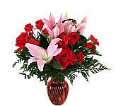 Sensation is a red vase of red roses, Stargazer lilies and more red blooms. Say I Love You with this Canada Flowers Original arrangement.