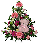 Pink, mauve, yellow, white and green flower arrangement in a handled wicker basket plus cute plush teddy bear · for baby and mom.