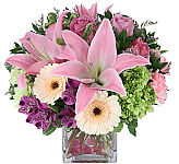 arrangement of pink lilies, green hydrangea, soft pink carnations, purple alstroemeria, soft yellow gerbera, and lavender roses