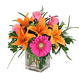 Popular Mother's Day floral arrangement of colourful orange, pink and fuchsia flowers for delivery across Canada.