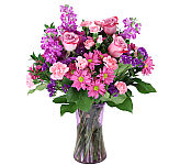 Canada Flowers presents Daydream · a lovely flower arrangement in lavender, pink and purple shades. Featuring same day florist delivered flowers across Canada.