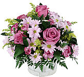 A fresh, lovely floral basket in lavender, yellow and purple colours with roses, daisies, asters and alstroemeria.