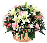 A handled wicker basket is arranged with pretty pink blooms for Administrative Professionals Day. Featuring same day Canadawide delivery.
