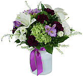 Treasure Garden is an elegant floral gift in a glass vase, with lavender roses, lisanthus, lilies and more.