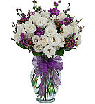 Our luxurious rose garden bouquet is a premium arrangement of several long stem white roses, white spray roses, purple stock and pink waxflower.