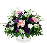 Charming flower basket featuring white, pink and purple flowers. A perfect get well gift basket for delivery across Canada.