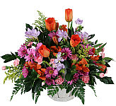 Popular flower basket of pretty lavender, pink, mauve and yellow flowers. Florist designed and delivered same day across Canada.