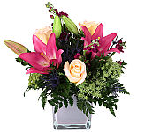 Canada Flowers presents Nebula, unique vase arrangement featuring pink lilies and pink roses. No extra service charges.