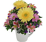 Sensational coffee mug flower arrangement to show your thanks. Flowers delivered same day across Canada.